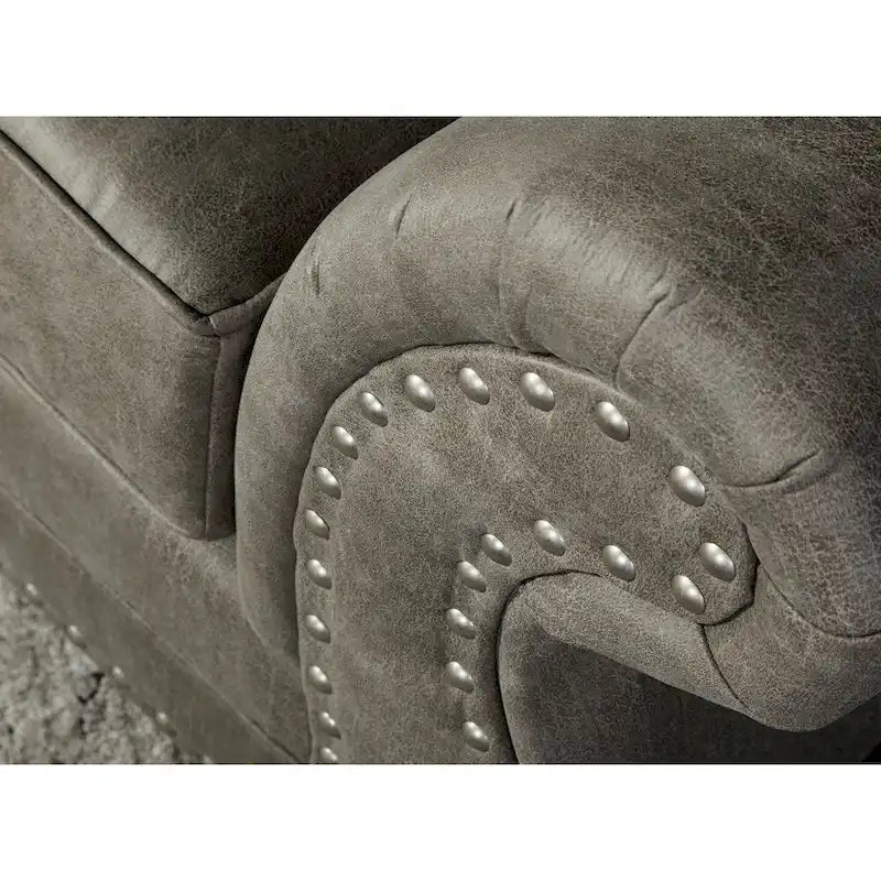 Divanetto per 2 in finta pelle grigia con borchie decorative
